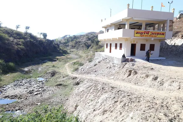 Maharishi Ashram building beside the hills